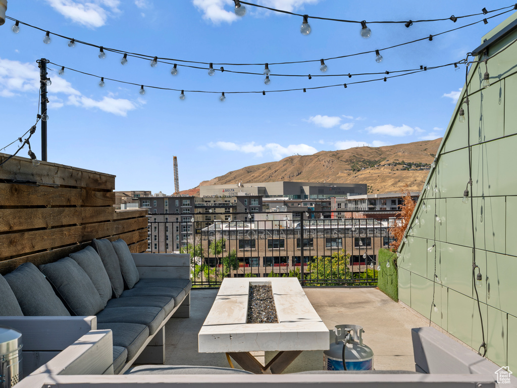 View of patio featuring an outdoor hangout area and a mountain view