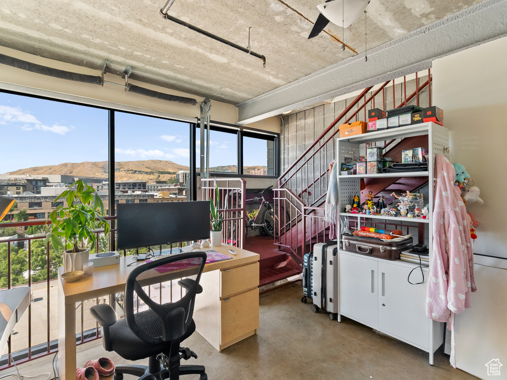 Office area featuring finished concrete flooring
