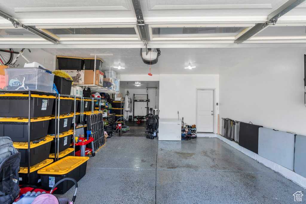 Garage featuring a garage door opener