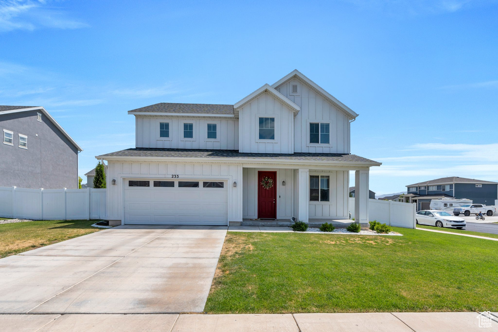 Modern farmhouse featuring board and batten siding, concrete driveway, an attached garage, a porch, and roof with shingles