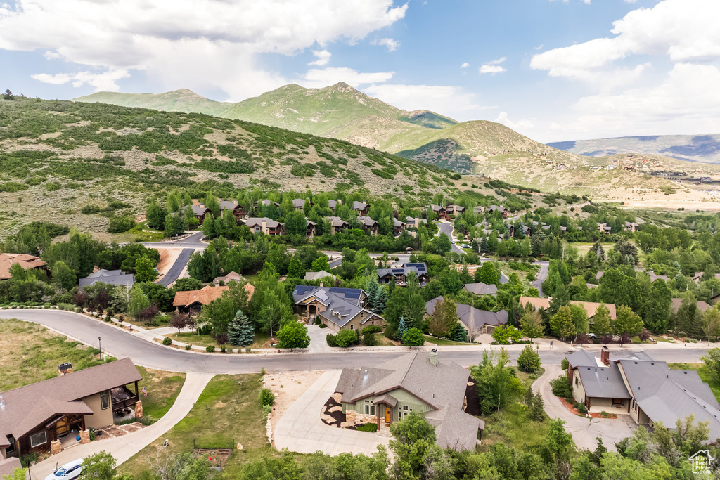 Aerial perspective of suburban area featuring a mountain backdrop