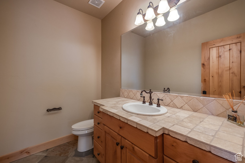 Bathroom with vanity and toilet