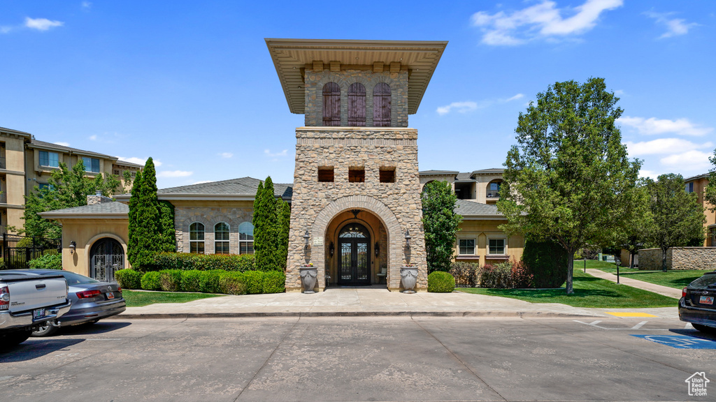 View of front of home with french doors and stone siding