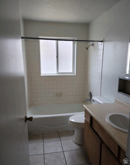 Full bathroom with vanity, bathtub / shower combination, and tile patterned flooring