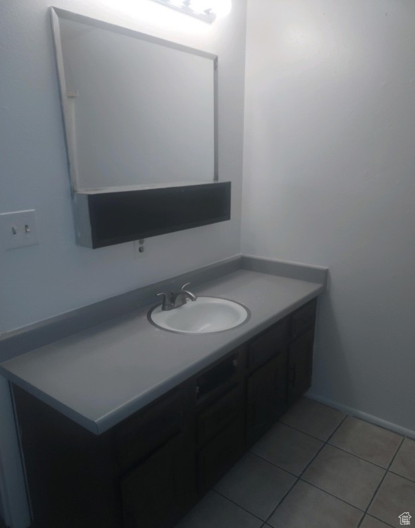 Bathroom featuring vanity and tile patterned flooring