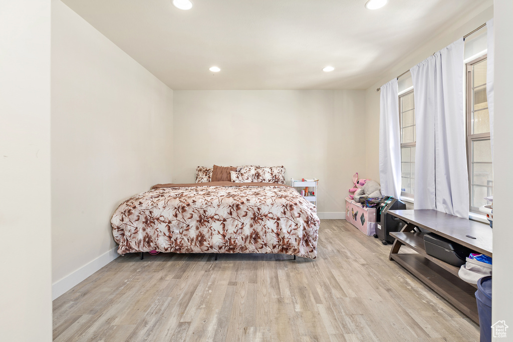Bedroom featuring wood finished floors and recessed lighting