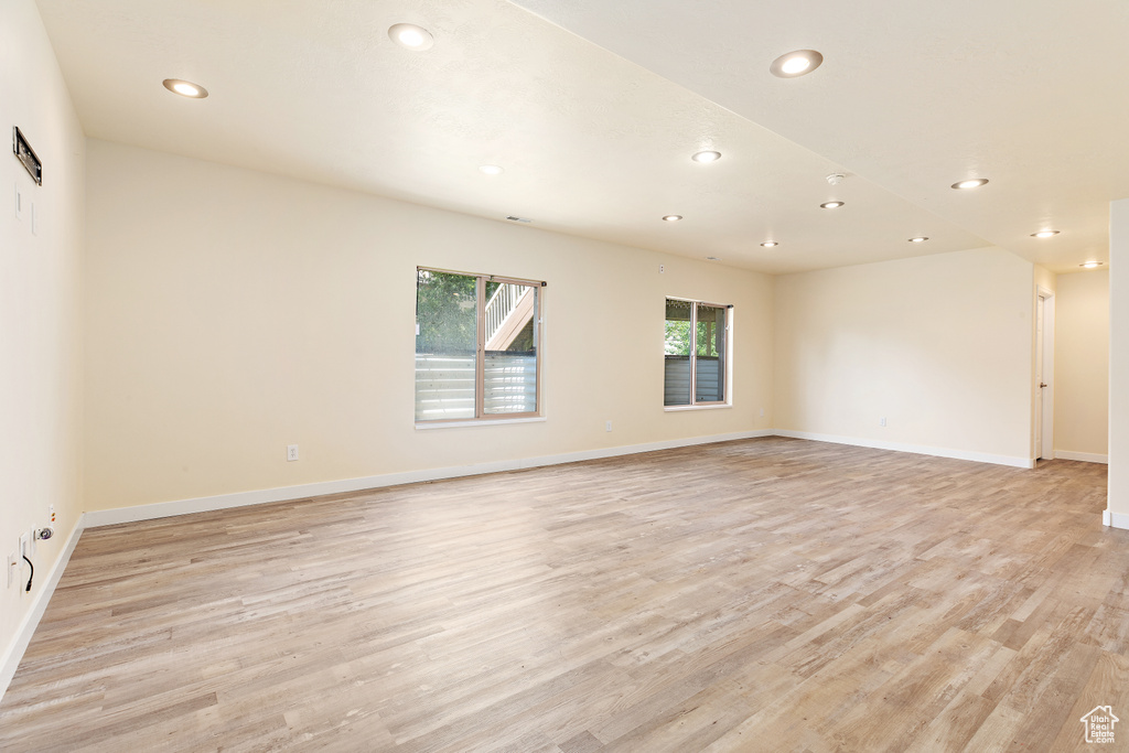 Empty room with recessed lighting and light wood finished floors