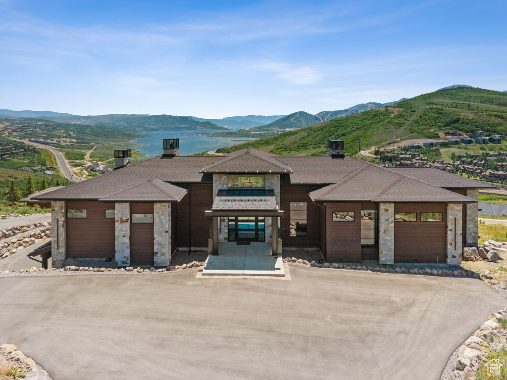 Prairie-style home featuring a mountain view