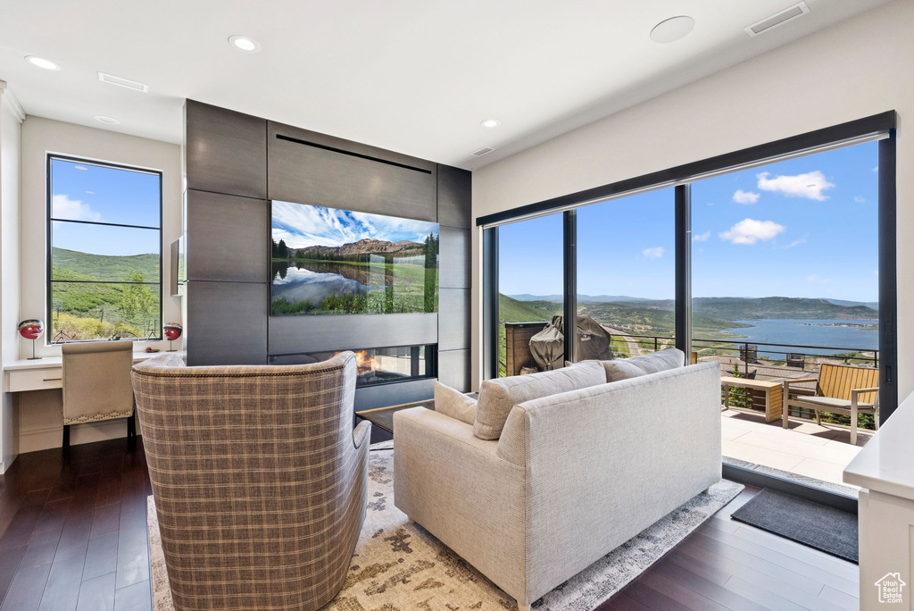 Living area featuring hardwood / wood-style floors and recessed lighting