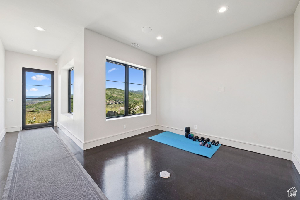 Workout room featuring recessed lighting