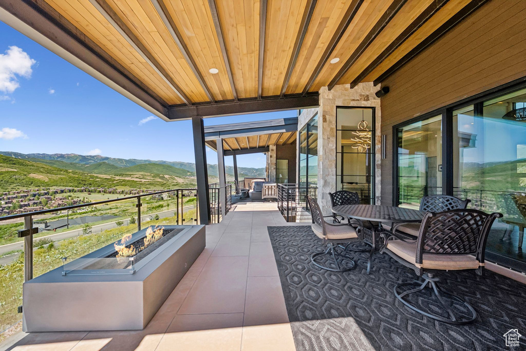 Patio / terrace featuring a mountain view and an outdoor fire pit