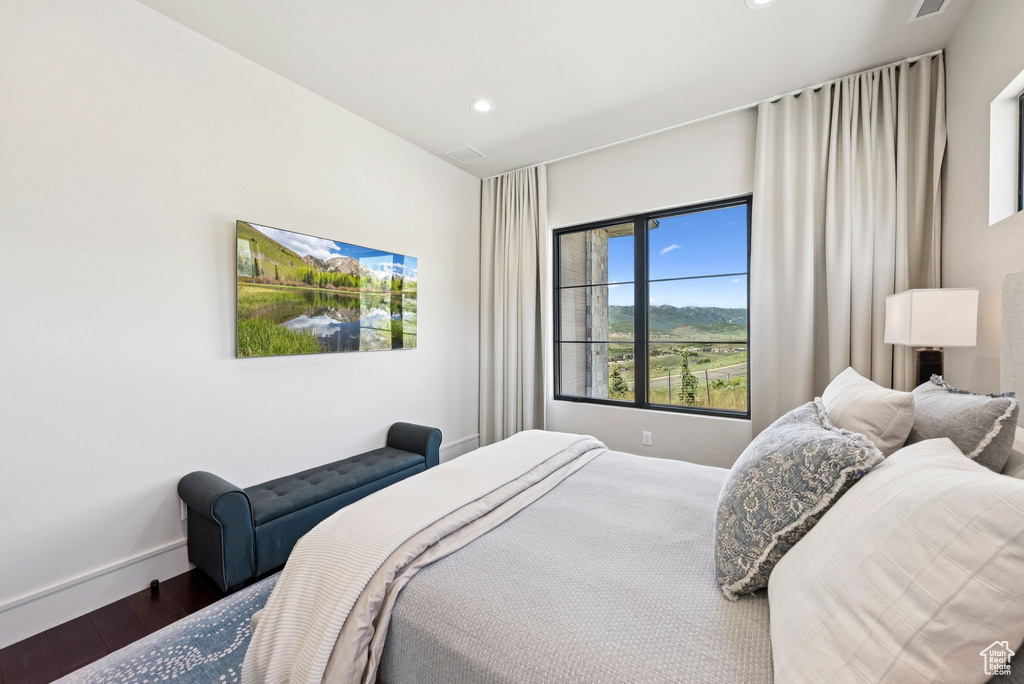 Bedroom featuring wood finished floors and recessed lighting