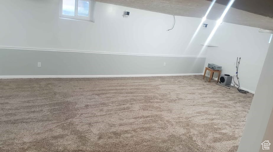 Basement with carpet flooring and baseboards