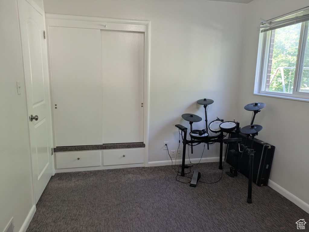 Unfurnished office with carpet and baseboards
