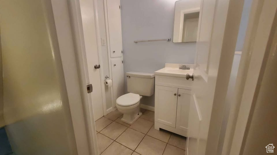 Bathroom featuring vanity and tile patterned flooring