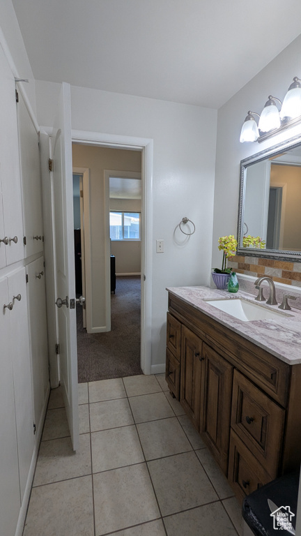 Bathroom featuring vanity and tile patterned flooring