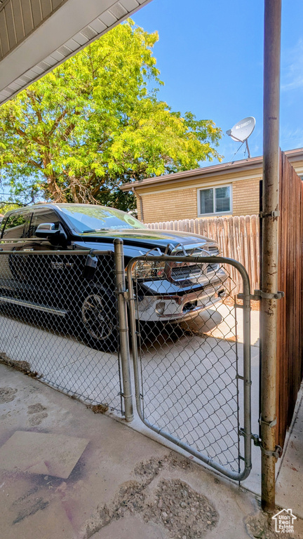 View of parking with a gate