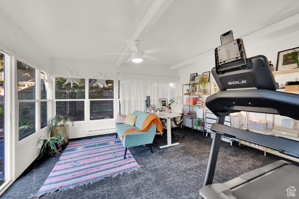 Carpeted office with a ceiling fan