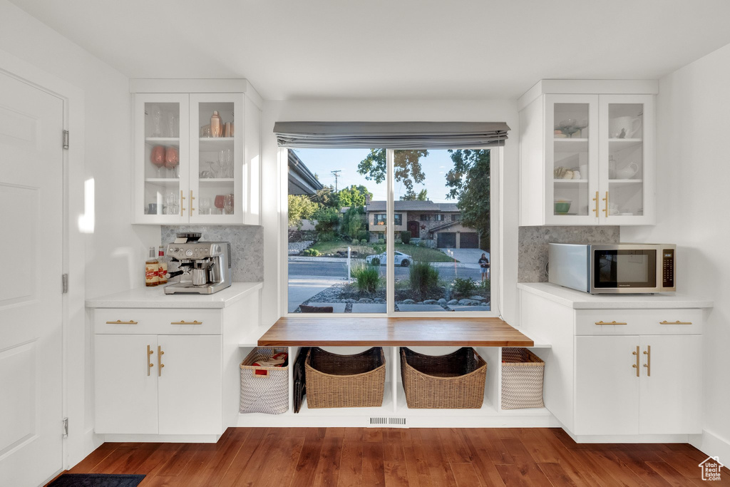 Unfurnished dining area featuring wood finished floors