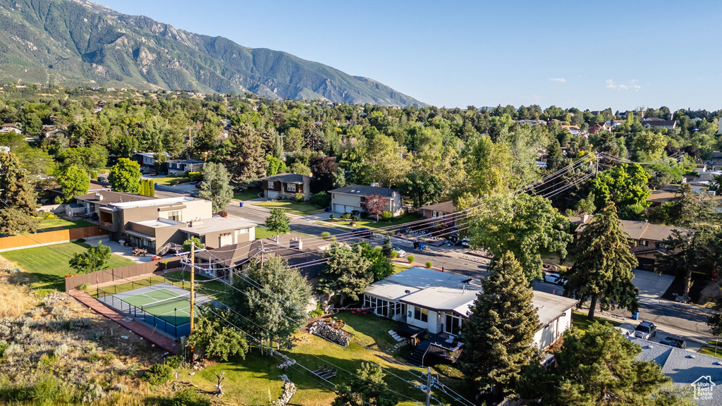 Aerial view of residential area featuring a mountainous background