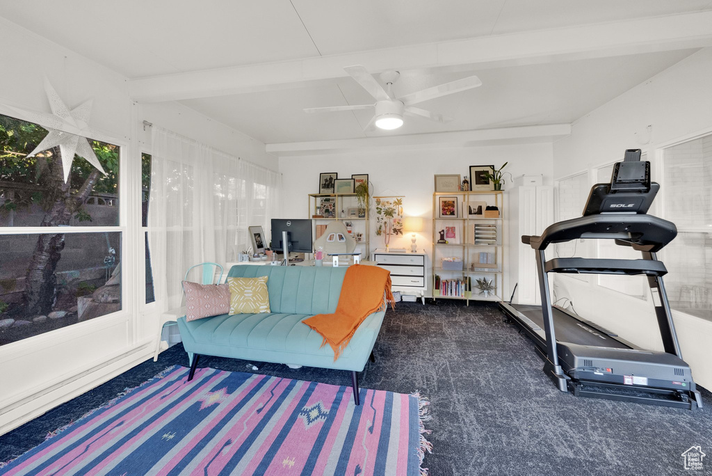 Living room featuring ceiling fan and carpet floors