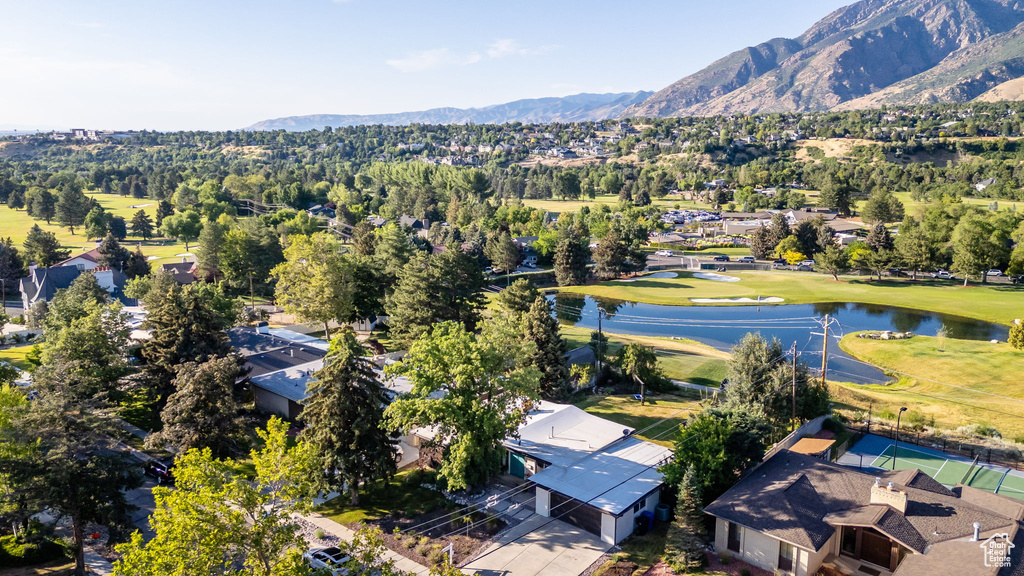 Aerial perspective of suburban area featuring a water and mountain view and a golf course