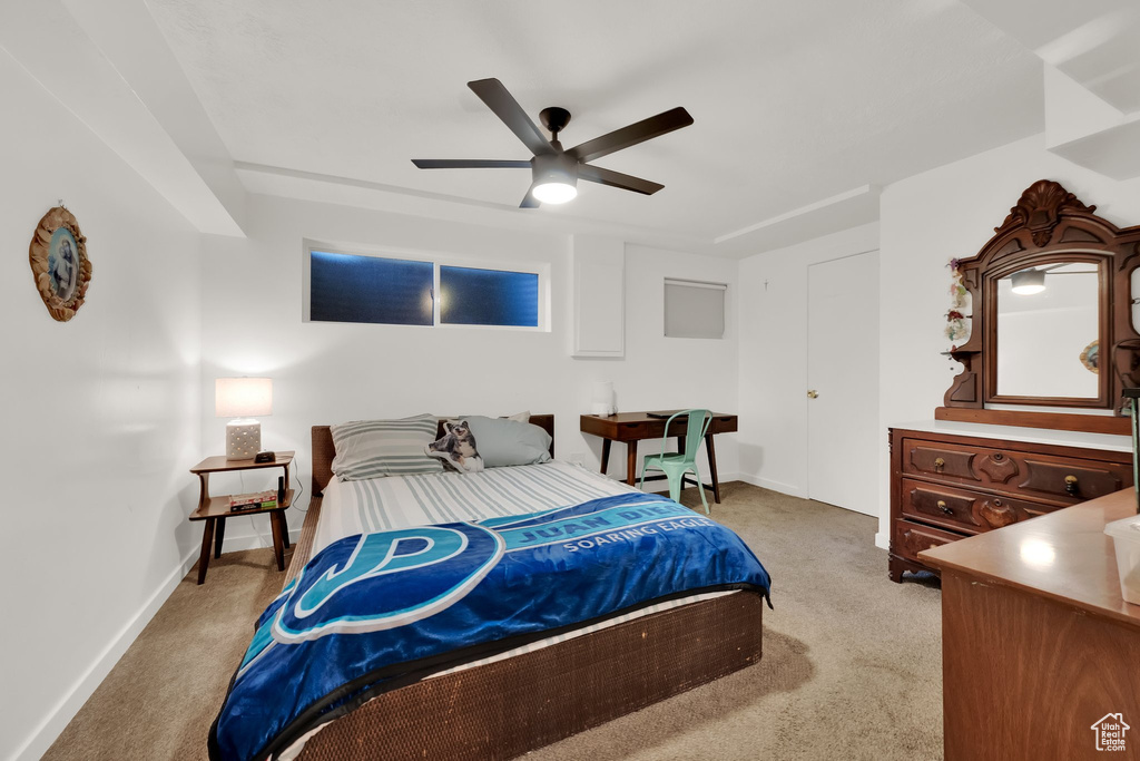 Bedroom with light carpet and ceiling fan