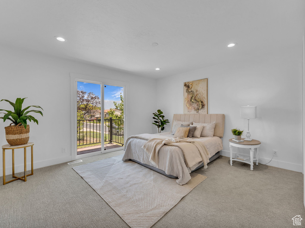 Carpeted bedroom with access to outside and recessed lighting