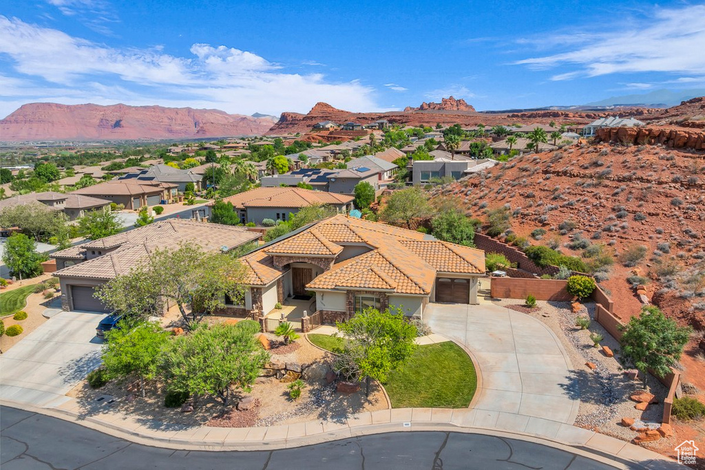 Aerial view of residential area featuring a mountain backdrop