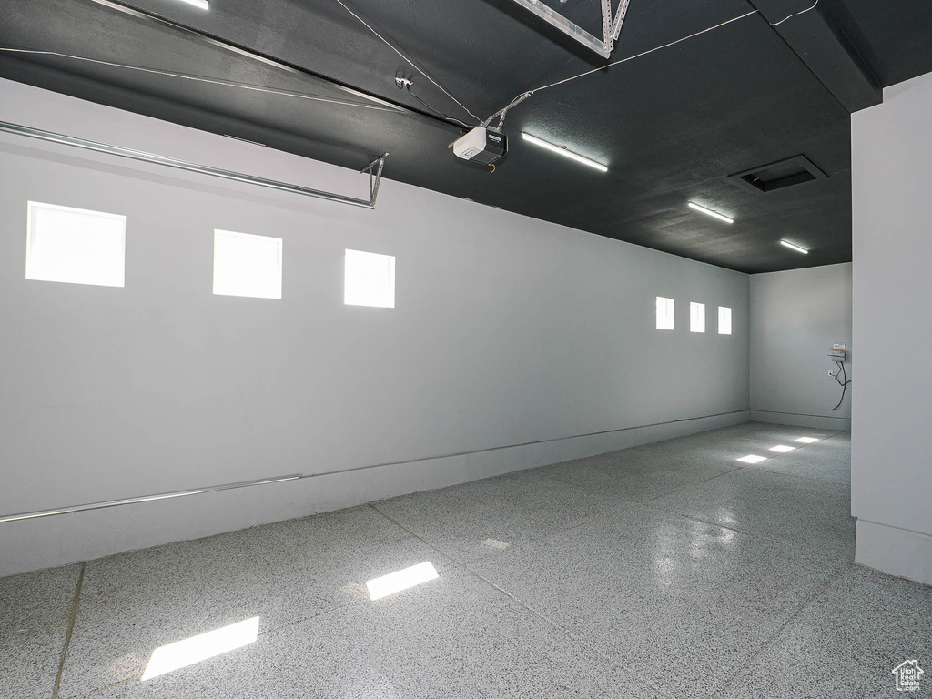 Garage featuring a garage door opener