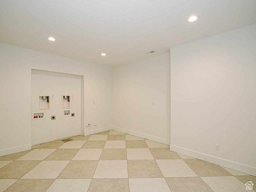 Spare room featuring recessed lighting and baseboards