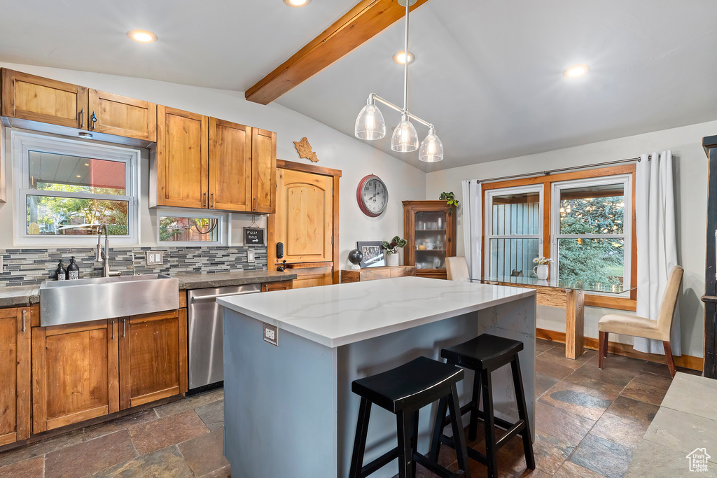 Kitchen featuring stainless steel dishwasher, a center island, tasteful backsplash, a kitchen breakfast bar, and recessed lighting