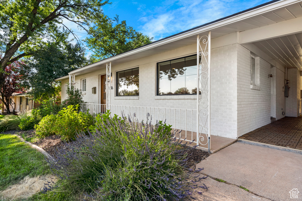 Property entrance featuring brick siding