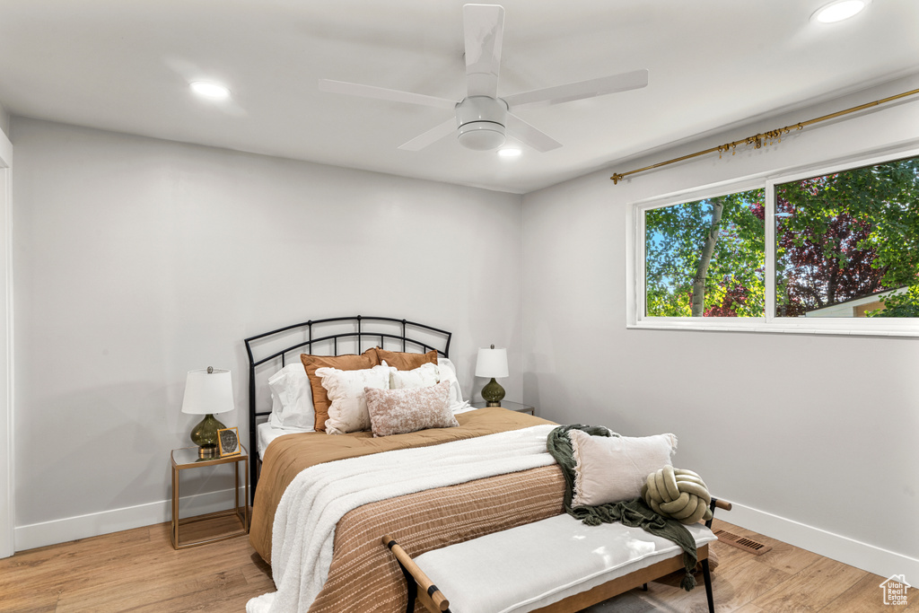 Bedroom featuring recessed lighting, light wood-type flooring, and a ceiling fan