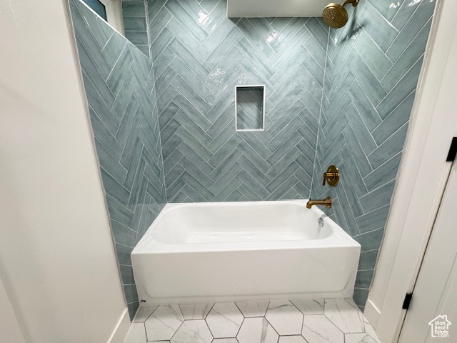Bathroom with shower / bath combination and marble finish floors