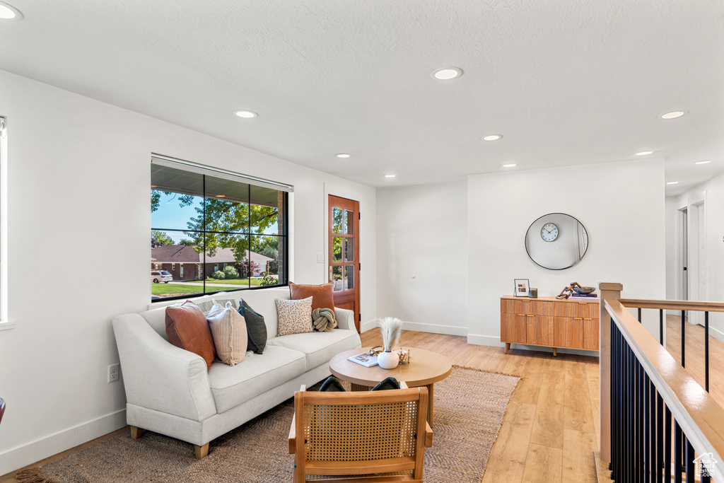 Living room featuring recessed lighting and light wood-style floors