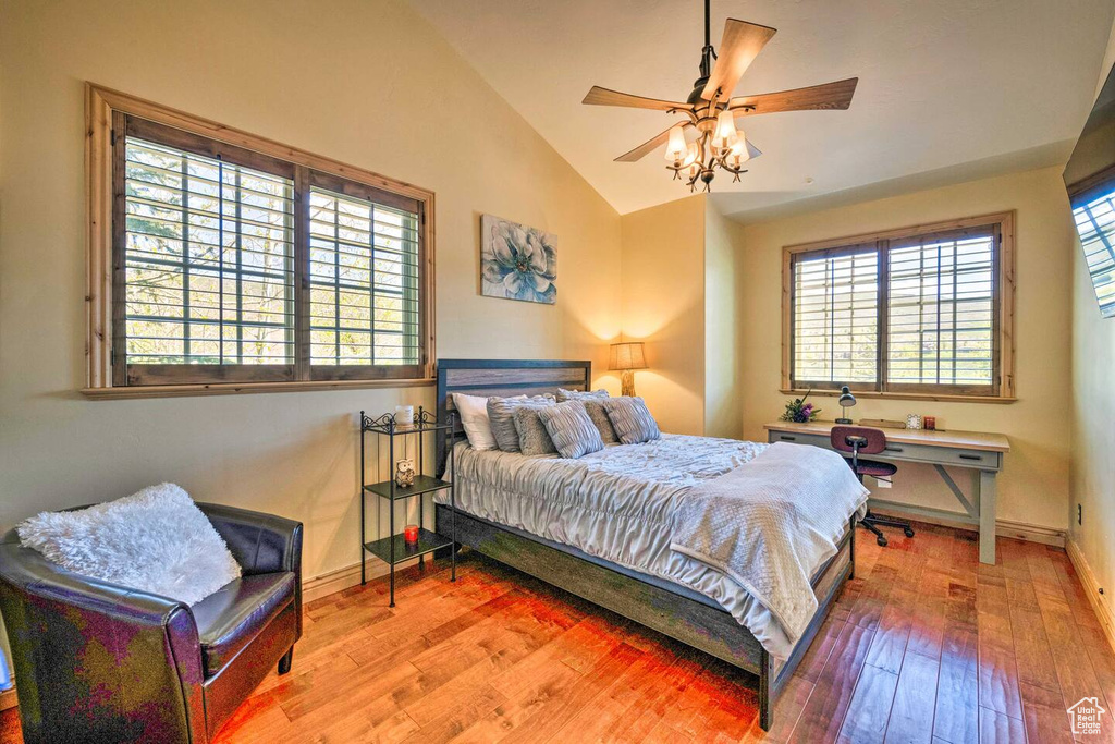 Bedroom featuring vaulted ceiling and light wood-style flooring