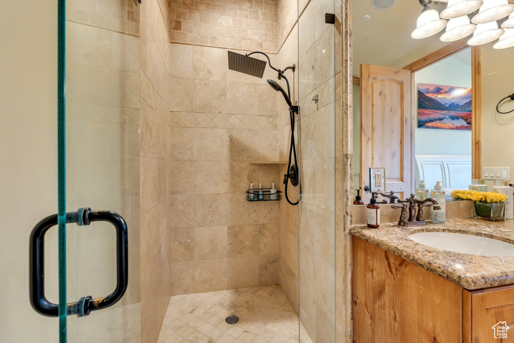 Bathroom with a shower stall and vanity