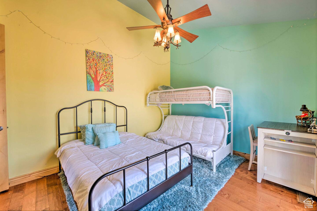 Bedroom with wood finished floors and a ceiling fan