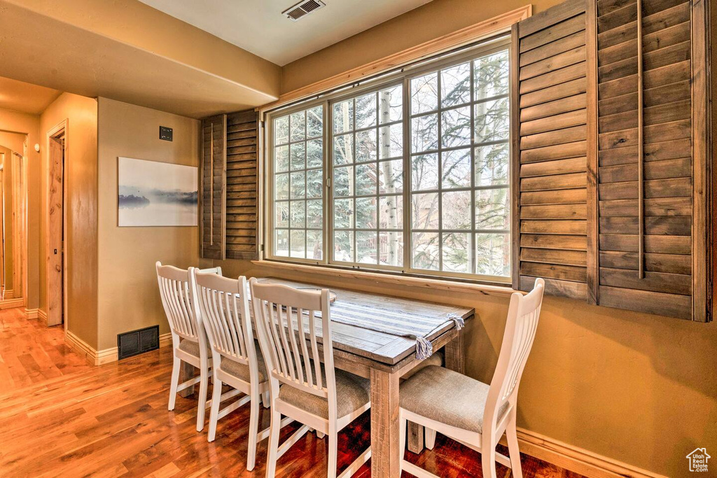 Dining area featuring wood finished floors and baseboards