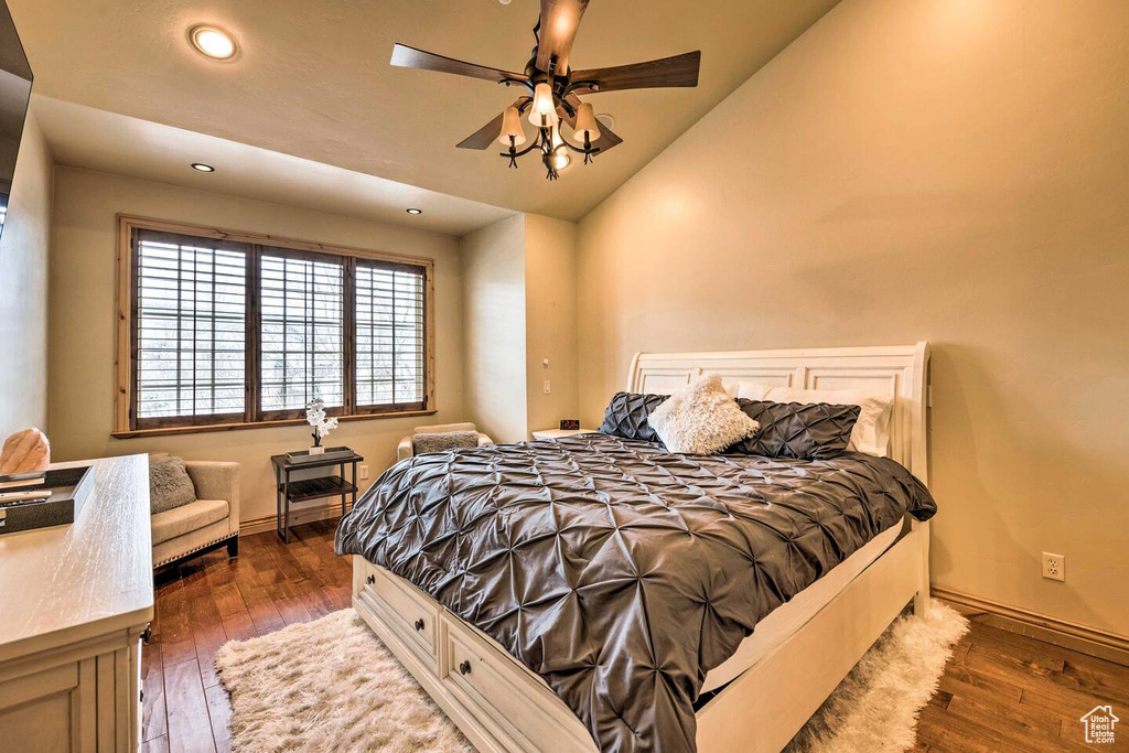 Bedroom featuring wood-type flooring, recessed lighting, vaulted ceiling, and a ceiling fan