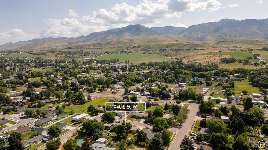 Aerial perspective of suburban area featuring a mountainous background