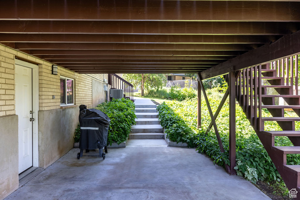 View of patio / terrace featuring stairs and area for grilling
