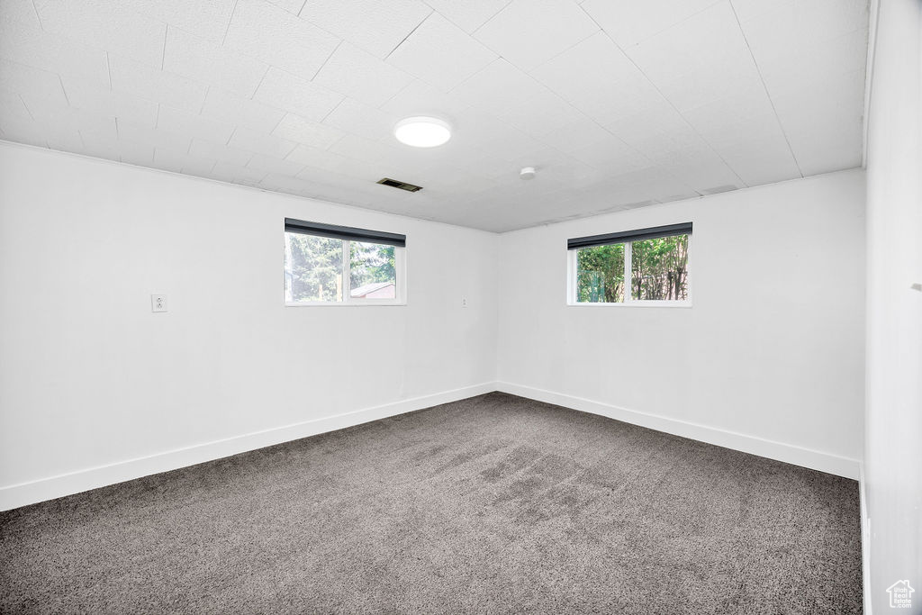 Carpeted empty room with plenty of natural light