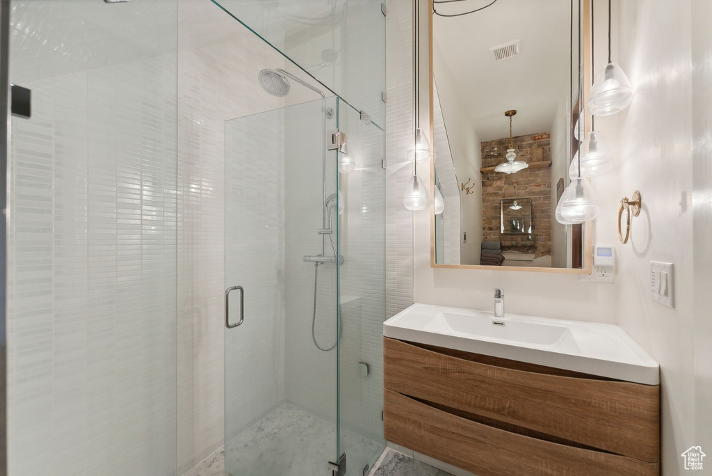 Bathroom with a stall shower and vanity