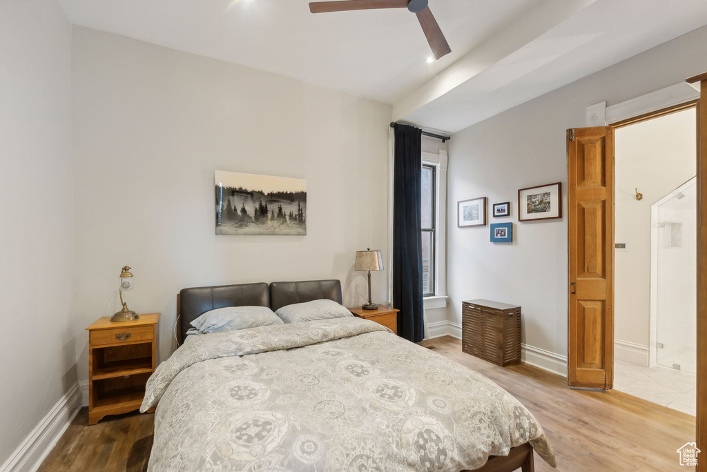 Bedroom featuring wood finished floors and a ceiling fan