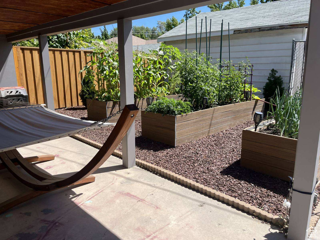 View of patio featuring a vegetable garden