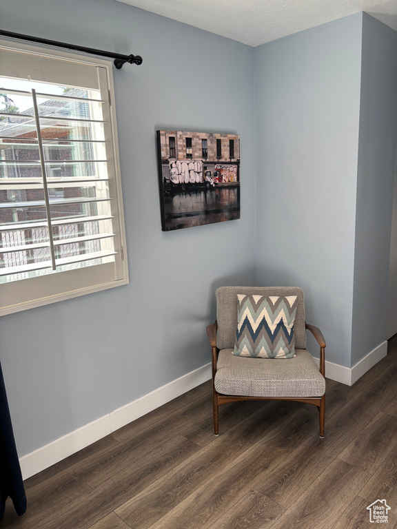 Sitting room featuring wood finished floors and baseboards