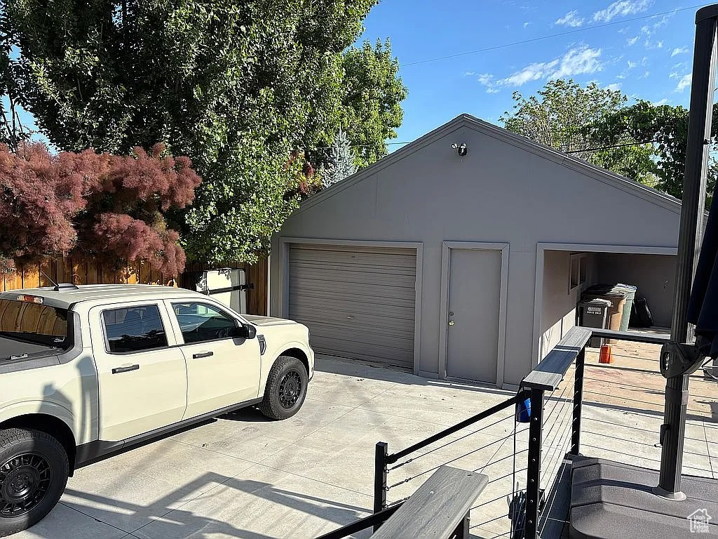 Detached garage with concrete driveway