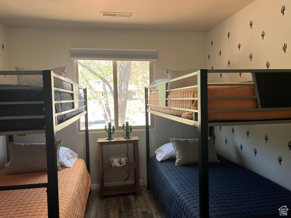 Bedroom with wood finished floors